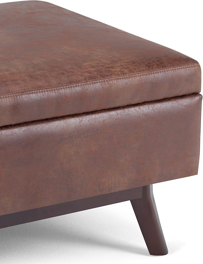 SIMPLIHOME Owen Coffee Table Storage Ottoman - 34" Wide x 19" High Upholstered Vegan Leather Rectangular Lift-Top Ottoman in Distressed Saddle Brown, Mid-Century Modern Bench with Tapered Legs